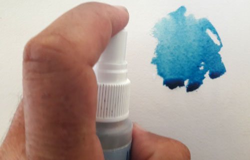 Using a spray bottle on watercolour paint to soften edges