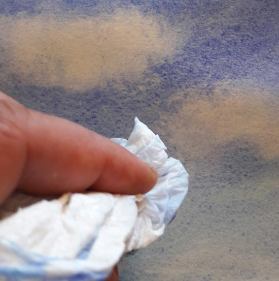 Lifting out clouds from a watercolor painting with tissue