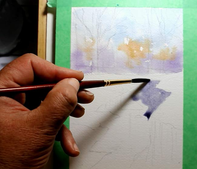 snowy forest with river watercolor winter landscape painting tutorial step 3 adding a lead in