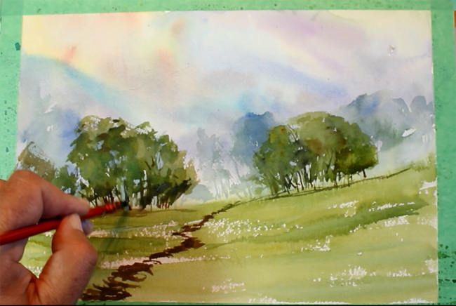 How to paint a misty watercolour landscape: adding shadows to the trees
